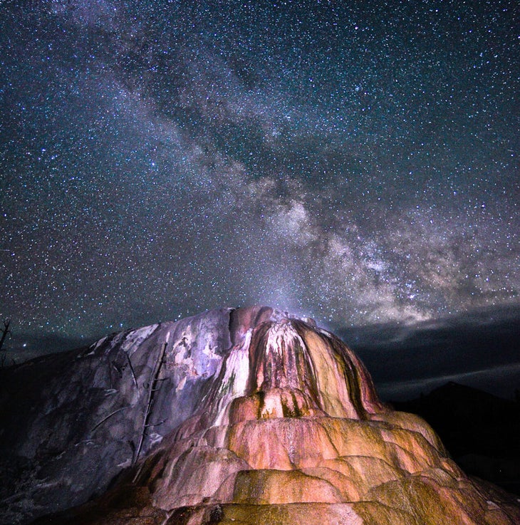 The Milky Way over Orange Mound Spring at Mammoth Hot Springs in Yellowstone