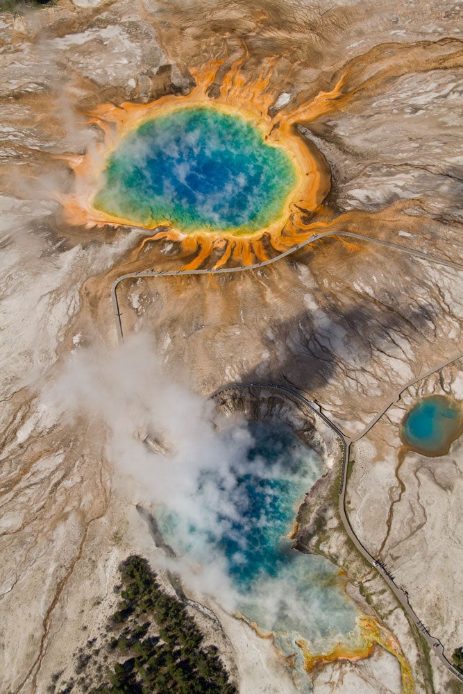 Yellowstone's Midway Geyser Basin including the Grand Prismatic Spring, Excelsior Geyser, Turquoise Pool, and Opal Pool.