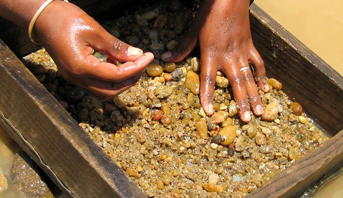Sapphire-hunting-rock-pile_Adobe_680 Sifting through rock in search of Montana sapphires.