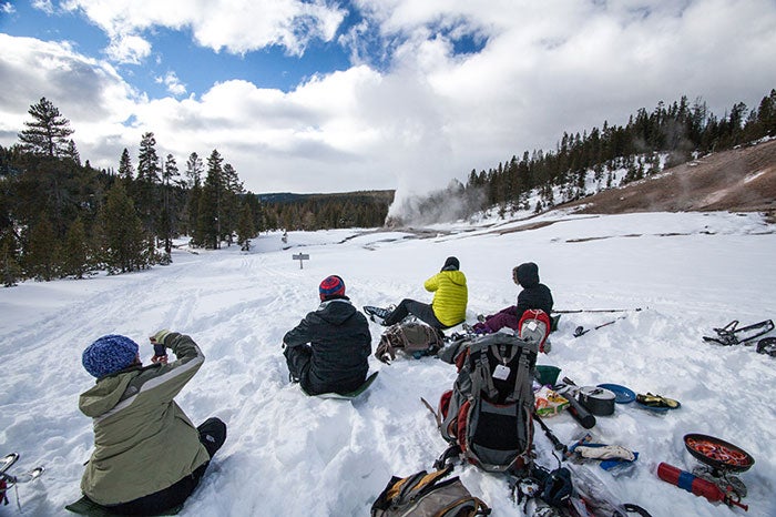 YS-Snowshoer-lunch-break_WildlandTrekking_700 Snowshoers taking a lunch break in Yellowstone