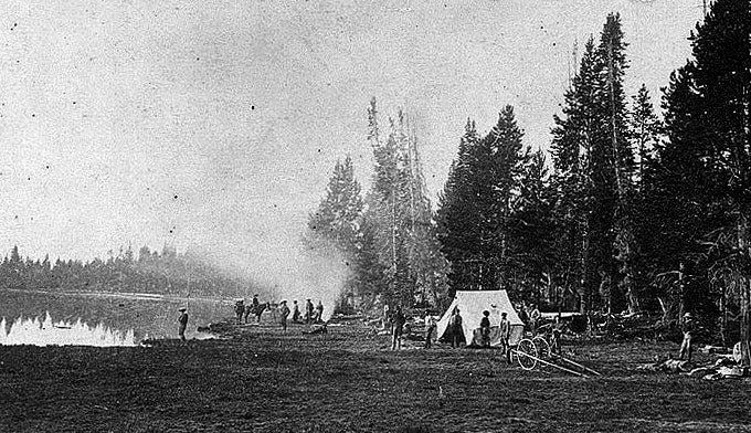 Camp-Yellowstone-1871_WikiPD_680x392 Photograph of Yellowstone. 1871, by William Henry Jackson. Camp on Mirror Lake during the Hayden Geologic Expedition of 1871