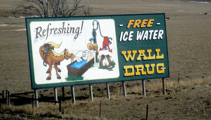 WallDrug-sign-ice-water_FlickrKyleTaylor_700 Wall Drug highway sign advertising free ice water.
