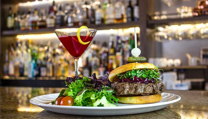 BigSkyResort-dining_CodyWhitmer_courtesy_700 Burger and cocktail at Everett’s 8800 at the Big Sky Resort