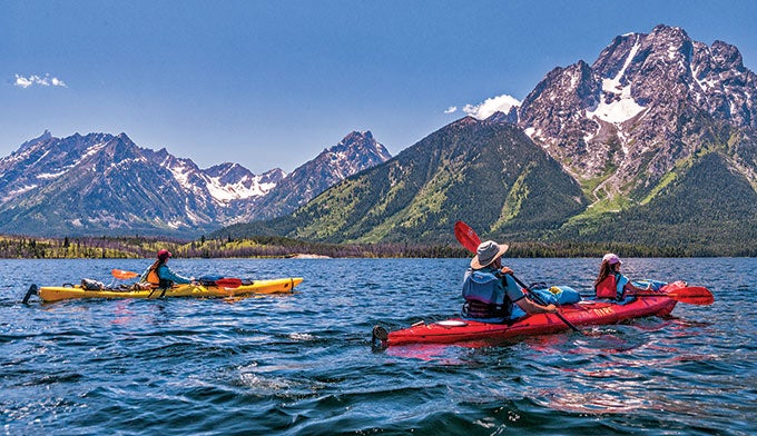 Teton-kayaking_JamesKaiserOARS_680 Kayaking on Jackson Lake in Grant Teton National Park. Photo by James Kaiser courtesy of O.A.R.S.