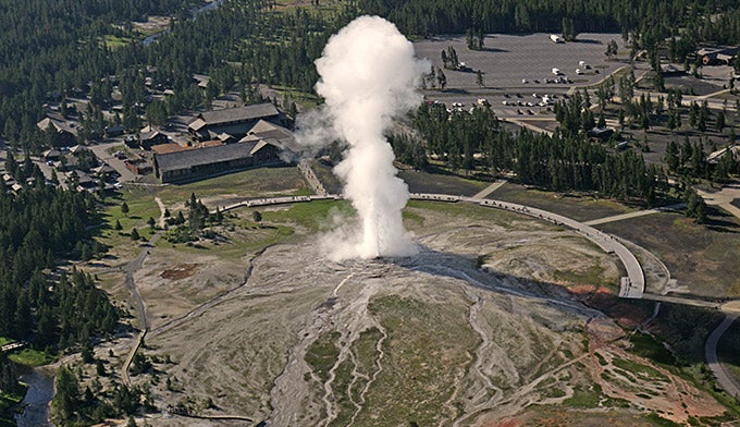 Aerial view of Old Faithful Geyser and Old Faithful Lodge.
