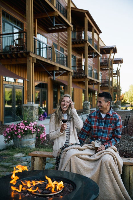 TetonSprings-Family-24_700v Family sitting around the firepit at Teton Springs Lodge & Spa