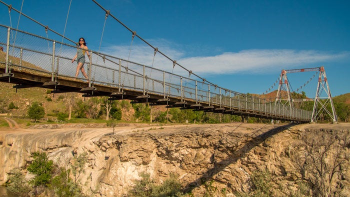 Thermopolis-suspensionbridge-_HotSpringsTravelTourism_700 Suspension bridge over Hot Springs State Park in Thermopolis, Wyoming