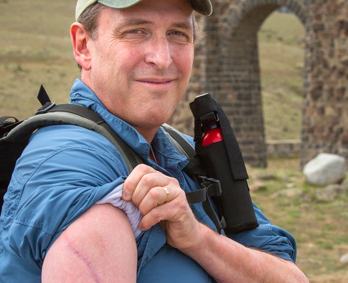 YS-Bear-Survivor_NPSPD_680 Bear attack survivor Jeff Brown wearing a bear spray canister.