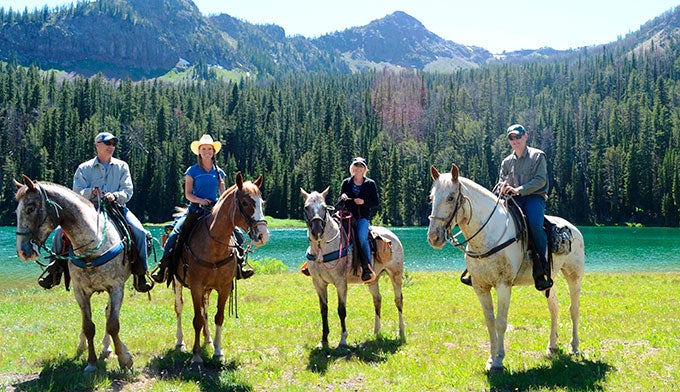 Horseback riding through Yellowstone.