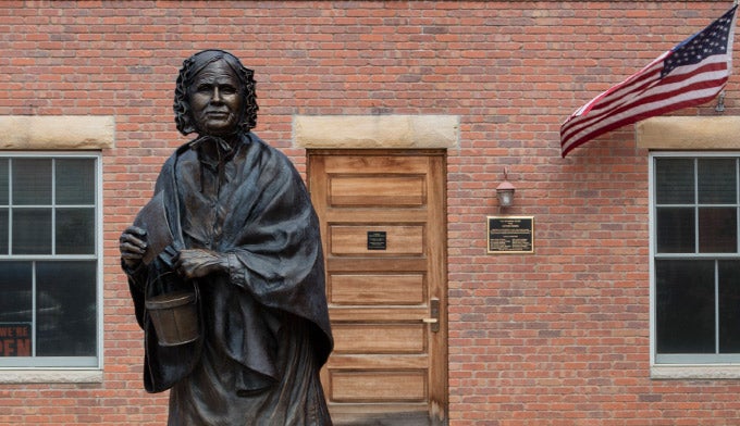 WY-Laramie-Louisa-Swain-1stwomanvote_WikiLibraryCongress_680 Statue of Louisa Swain, the first woman to vote in the United States.