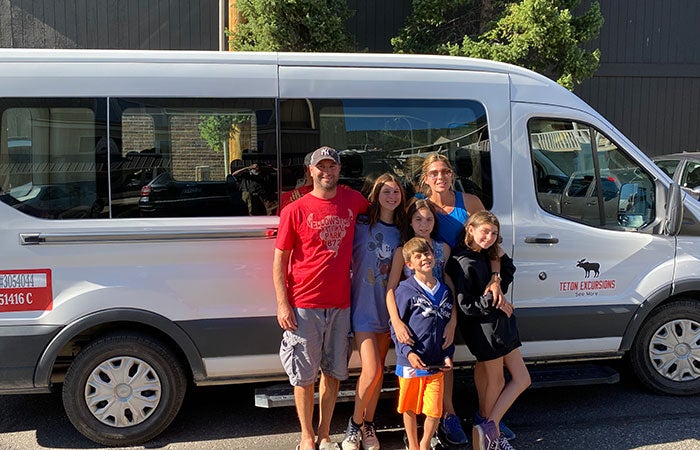 TetonExcursions-van-family_courtesy_700 Family with the Teton Excursions van getting ready for their Yellowstone road trip