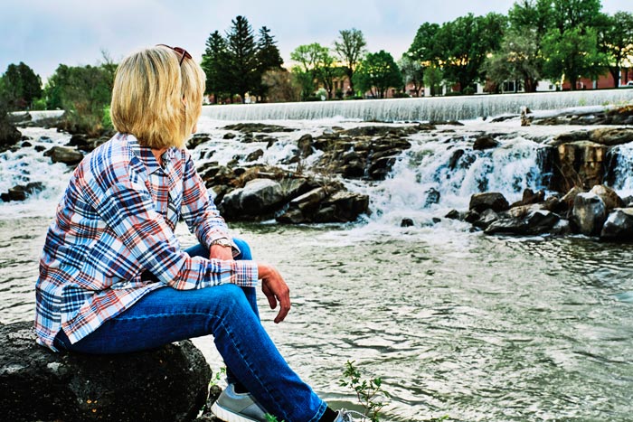 IdahoFalls-woman_iStock_700 Visitor enjoying the Greenbelt Trail on the Snake River in Idaho Falls, Idaho