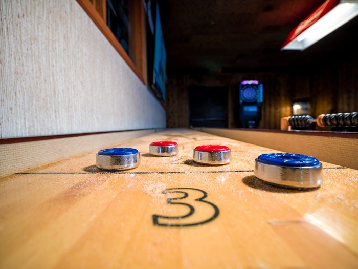 RidgelineHotelAtYS-YSMine-shuffleboard_DelawareNorth_700 Shuffleboard at the Yellowstone Mine at The Ridgeline Hotel at Yellowstone