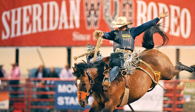 WY-Sheridan-Rodeo-bronco_courtesy_680 Bronco rider at Sheridan's WYO Rodeo. Courtesy photo