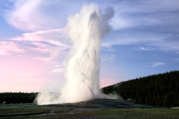 Yellowstone's most famous geyser, Old Faithful at Twilight