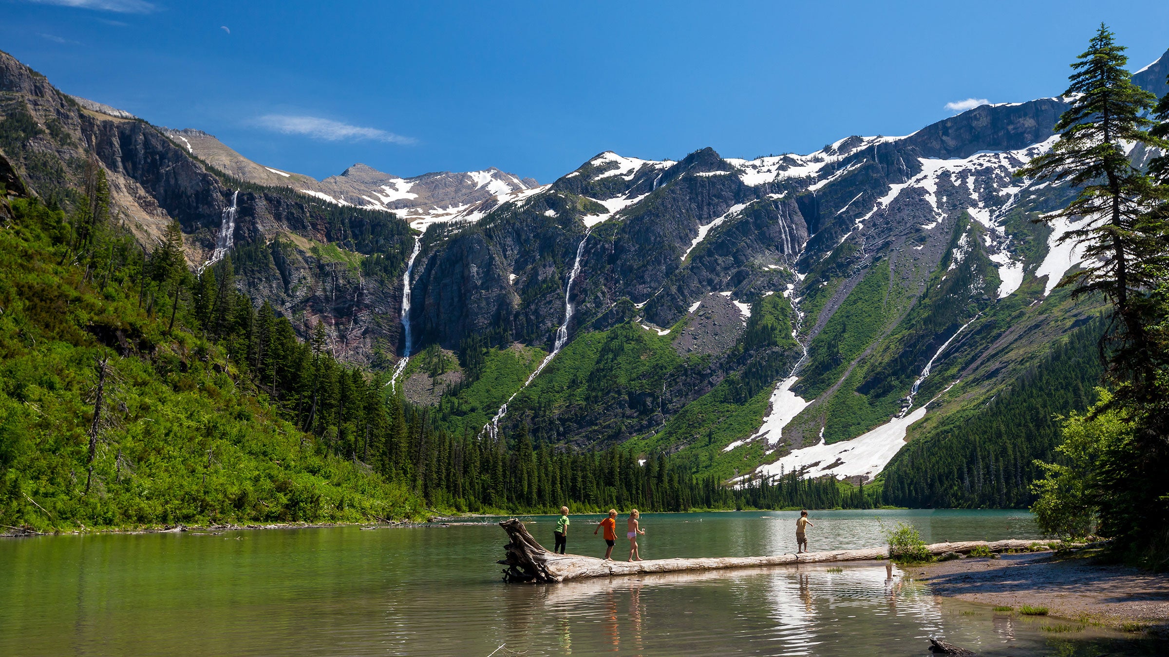 Kids play at Avalanche Lake in Glacier National Park