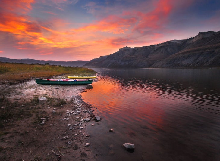 Canoes and kayaks adorn the shores of the White Cliffs, part of the Upper Missouri River Breaks National Monument.