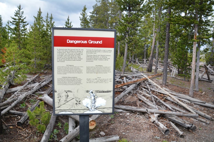 Sign warning of dangerous ground conditions at Norris Geyser Basin in Yellowstone.