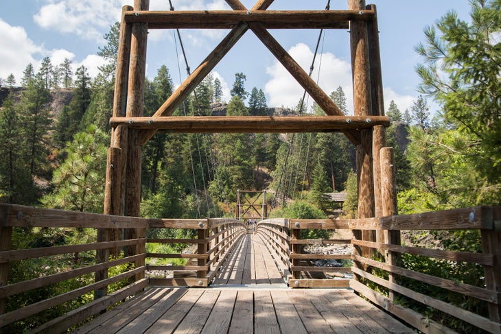 Walk over the river on the suspension bridge in Riverside State Park near Spokane