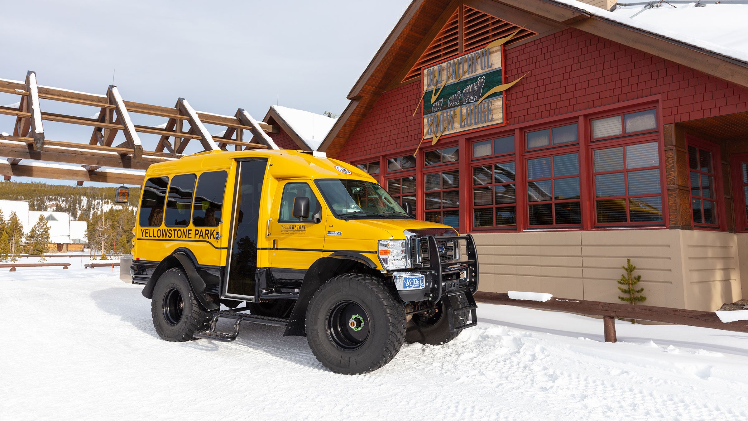 Old Faithful Snow Lodge with a Snowcoach arrival in Yellowstone National Park